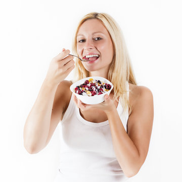 Happy Blonde Woman Eating Muesli