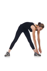 Obraz premium Young woman doing exercises on white