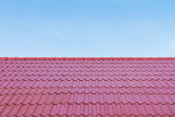 Red roof against blue sky
