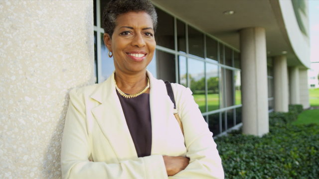 Female African American Teacher Modern Campus Close Up