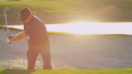 Golfer Using Sand Wedge Bunker - Powered by Adobe
