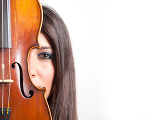 Young girl with violin against white background with copy space.