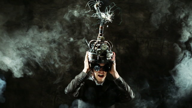 Business man wearing a brain-control helmet