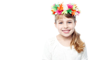 Child wearing wreath of flowers