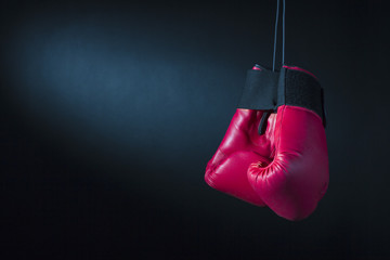 Boxing gloves on a dark background.