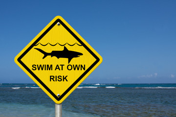 Use caution when swimming because sharks are present