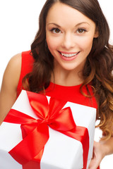 smiling woman in red dress with gift box