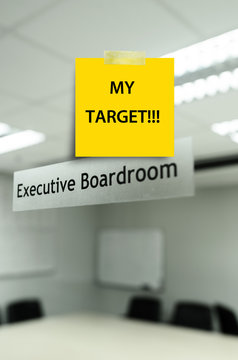 Yellow note message "my tarket' on Meeting room,take photo from