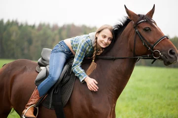Foto op Canvas girl embraces a horse © kalinina_alisa