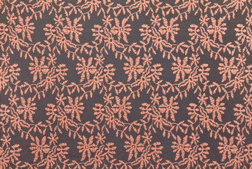 Pink lace over black background.