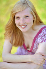Fototapeta premium Portrait of a beautiful young girl smiling