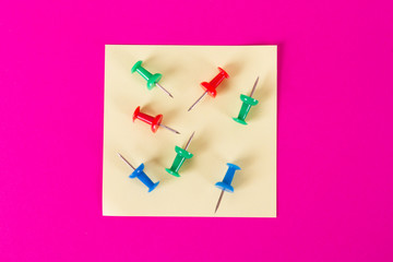 Sticky Post with Push Pins on Pink Background