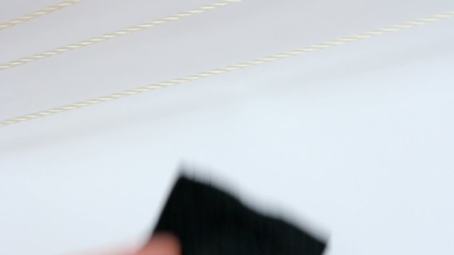 Colorful clothes pegs on a rope