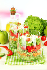 Tasty salad with fresh vegetables on wooden table