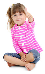 Little girl sitting on floor isolated on white