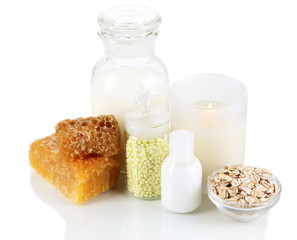 Honey and milk spa with oils and honey isolated on white