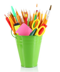 Colorful pencils and other art supplies in pail isolated