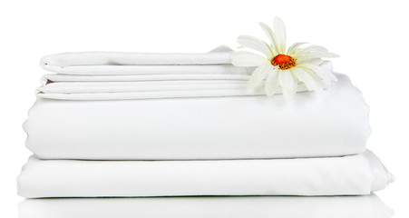 Stack of clean bedding sheets isolated on white