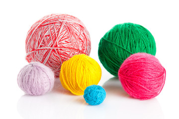 colorful different thread balls. wool knitting on white backgrou
