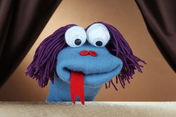 Fototapeta premium Puppet show on brown background