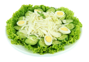 Delicious salad with eggs, cabbage and cucumbers, isolated