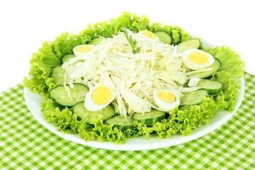 Delicious salad with eggs, cabbage and cucumbers, isolated