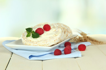 Tasty crispbread with berries, on white table