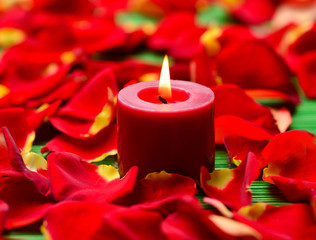 Close up of red candles with rose petals