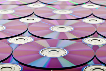 Bunch of new colorful cd drive  Close-up on  background 