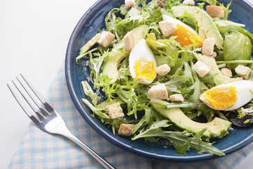 Avocado salad with boiled eggs