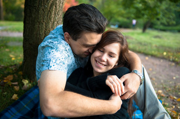 Loving couple embracing in autumn park