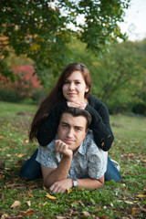 Loving couple lying on the grass