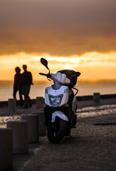 Lonely scooter on sunset background © 31etc
