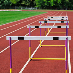 The concept of sport - the barriers on the treadmill stadium.