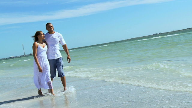 Young Ethnic Couple Alone Walking Beach