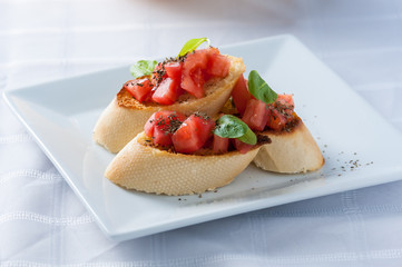 Tasty bruschetta on the plate - stock image
