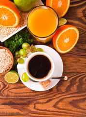 Breakfast including coffee,orange juice, muesli and fruits