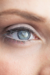 Fototapeta na wymiar Extreme close up on gorgeous shinning blue eye