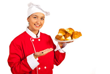 Chef serves croissants with pears