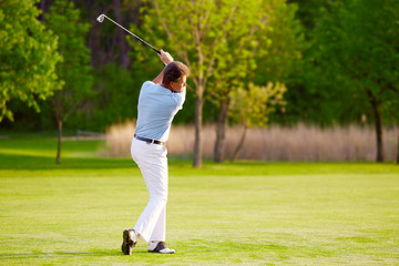 golf player on the golf course at tee-off