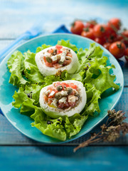 mozzarella stuffed with capers and tomatoes, selective focus