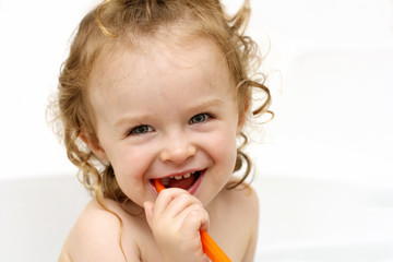Little toddler holding a tooth brush