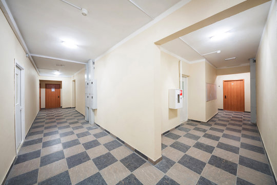Clean corridor with the floor with checkerboard pattern