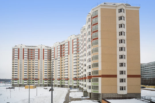 Large new residential apartment building of colored bricks