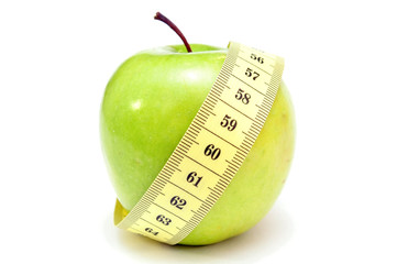 green apple with measure tape