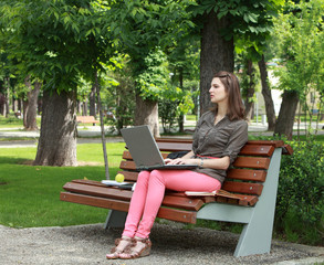 Young Woman Studying in a Park