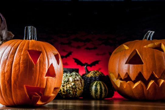 Dark composition of halloween pumpkins
