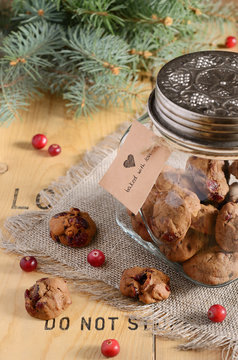 Christmas decoration with cookies, cranberry and fir tree branch