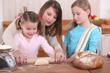 Mother and daughters baking