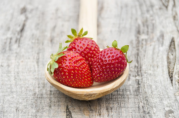Strawberries in a wooden spoon